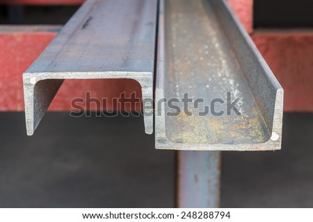 Channel (u shape beam) steel in factory shelf, focusing on the cutting edge