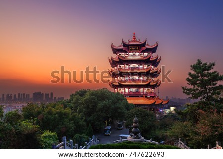 Yellow Crane Tower at twilight, the traditional Chinese multi-storey tower located on Sheshan (Snake Hill) in Wuhan, Hubei, China, 4 Chinese letters on tower is \