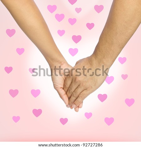 Love hands on pink background with hearts