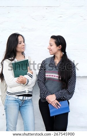 Two friends having talk over some discussion.