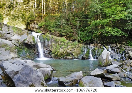 Beautiful landscape - waterfall in the Carpathian mountains