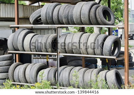 Car tires on racks tire service