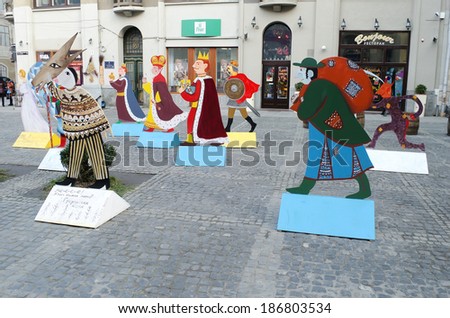 LVOV, UKRAINE - DECEMBER 27: Symbol of Christmas - Characters of Christmas carols, made of plywood, one of the squares in the center of Lvov on December 27, 2013 in Lvov, Ukraine