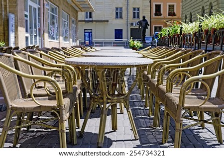 Wicker rattan furniture (tables and chairs) in the street in Lvov