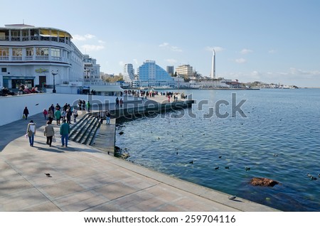 SEVASTOPOL, CRIMEA, RUSSIA - NOVEMBER 04: People walk along the promenade in Sevastopol Bay on November 04, 2014 in Sevastopol, Crimea, Russia