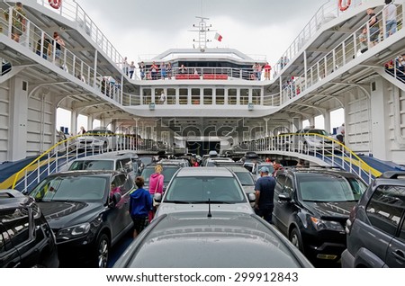 KERCH, CRIMEA, RUSSIA - JUNE 26: Cars and passengers on the ferry in the port of Crimea on June 26, 2015 in Kerch, Crimea, Russia