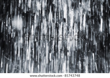 The rain. Blur water spray - drops in motion.