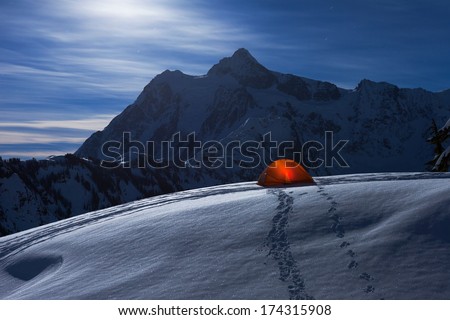 Glowing Tent under Moonlight on Snow Mountain