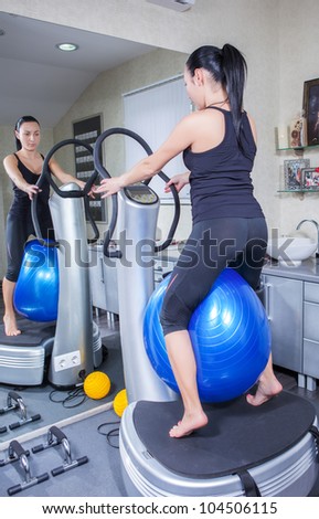 beautiful woman on trainer machine in sport gym
