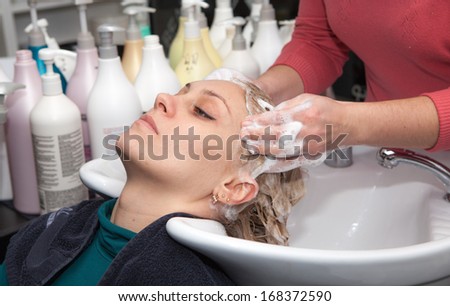 hair washing at a hairdressing salon, young caucasian girl