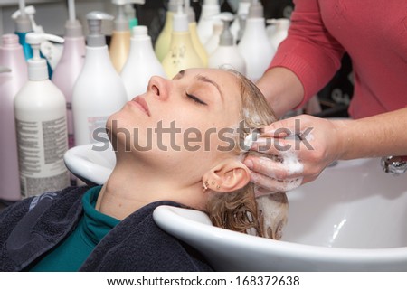 hair washing at a hairdressing salon, young caucasian girl