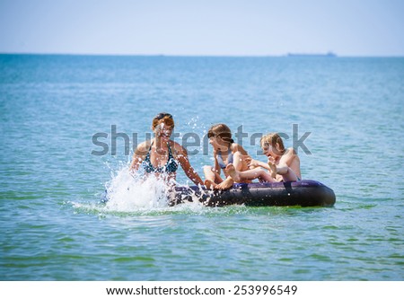 Happy family having fun on air bed