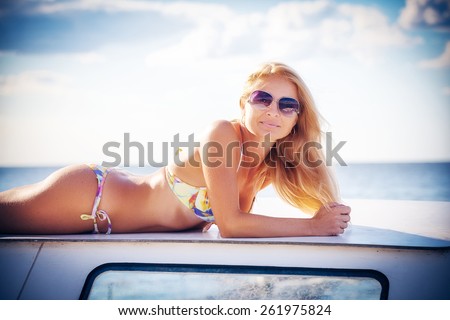 young beautiful girl by the boat