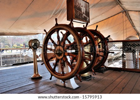 Military frigate. Threefold steering wheel of big sailing boat