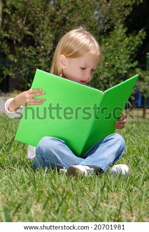 The girl with book in park
