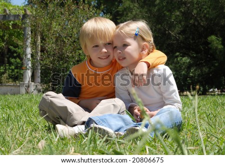 Emotional couple on a glade in park