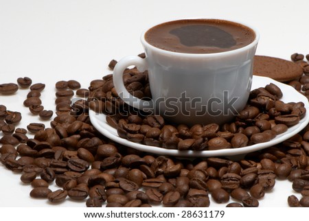 Cup with coffee, costing on coffee grain