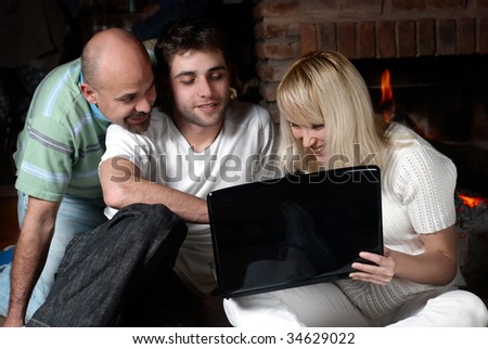 Happy family with laptop in quiet, house conditions