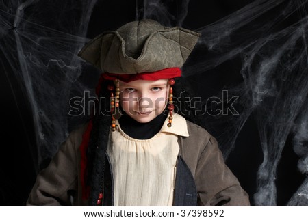 Little boy wearing pirate costume