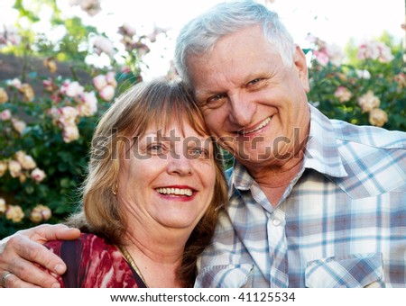 Smiling happy elderly couple in love outdoor
