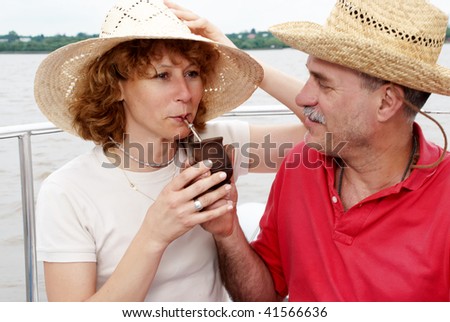 Elderly happy couple onboard the yacht