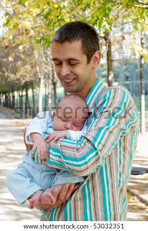 The father with the newborn son in park