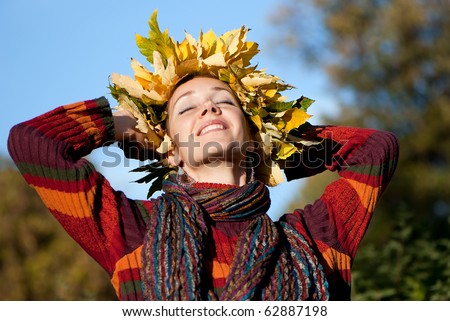 Lovely little woman with autumn wreath on her head