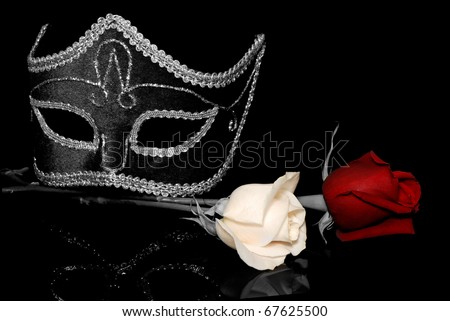 The flowers and Venetian mask  on a black background