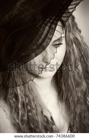 old portrait photo a beautiful young women in hat