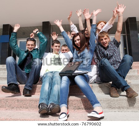 Group of male and female students inside an academic building