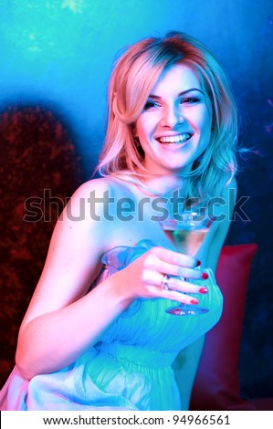 pretty woman drinking cocktail in nightclub, different kinds of lighting