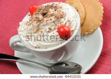 Cappuccino  with cream and chocolate flakes