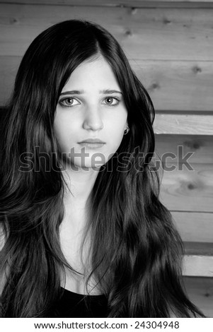 Face of the beautiful young girl with sad eyes