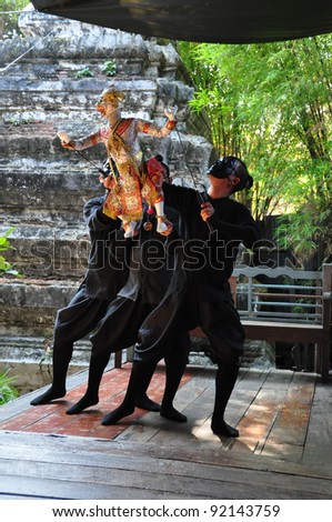 BANGKOK, THAILAND - DEC 18 : The little Thai puppet play requires the synchronized efforts of three puppeteers. They play at Klong Bang Loung on DEC 18, 2011 in Bangkok Thailand