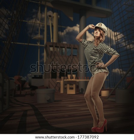 Sexy Woman - Captain's in sea peak-cap and stripped vest stand on deck