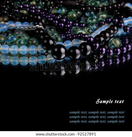 beads and accessory on black background