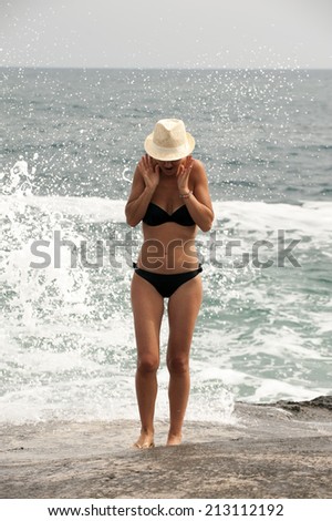 girl splashes in the sea