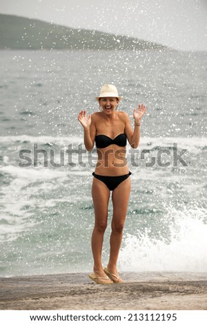 girl splashes in the sea