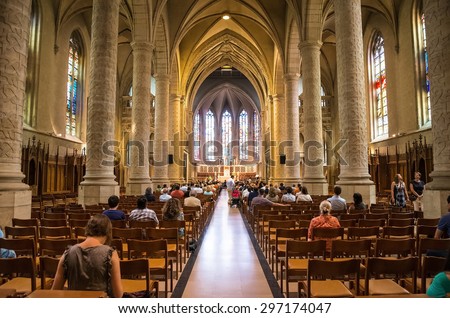 Luxembourg City, Luxembourg - July, 12, 2015 : People during mass in catholic Church, Luxembourg City on July, 12, 2015