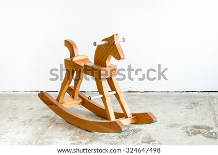 Cute vintage classic rocking horse chair children could enjoy the riding on white background