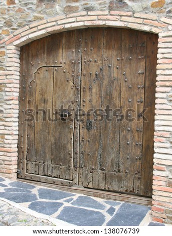 old wooden door in the beautiful village of cadaques (Costa Brava, Spain).