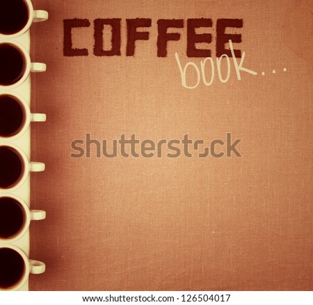 Notebook for coffee menu on saking with coffee cups.