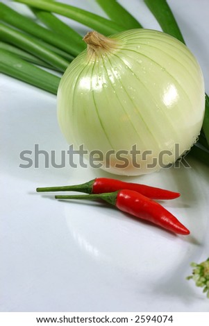 Chilli, onion and green onion on the white background
