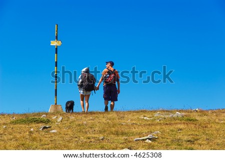 Couple and a Sign in the mountain
