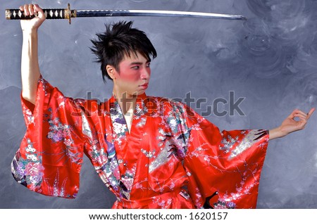 An Asian Man in a Geisha outfit, holding a sword