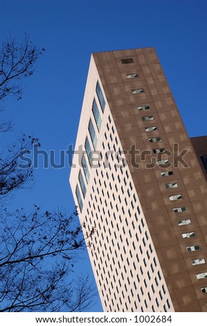 worm\'s eye view of a tall brown-colored skyscraper