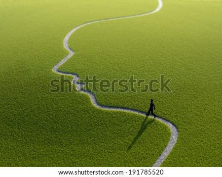 A lonely person walking along a face-shaped path A lonely person walking along a face-shaped path
