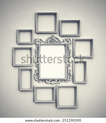 Wall with simple frames surrounding ornamented frame in the middle