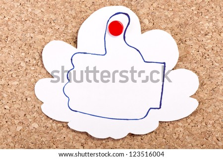 Cloud shape paper note with a like thumb drawing inside with a pen on a cork-board/Like cloud