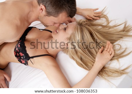 Close Up Of A Sexy Couple Kissing And Playing In Bed.